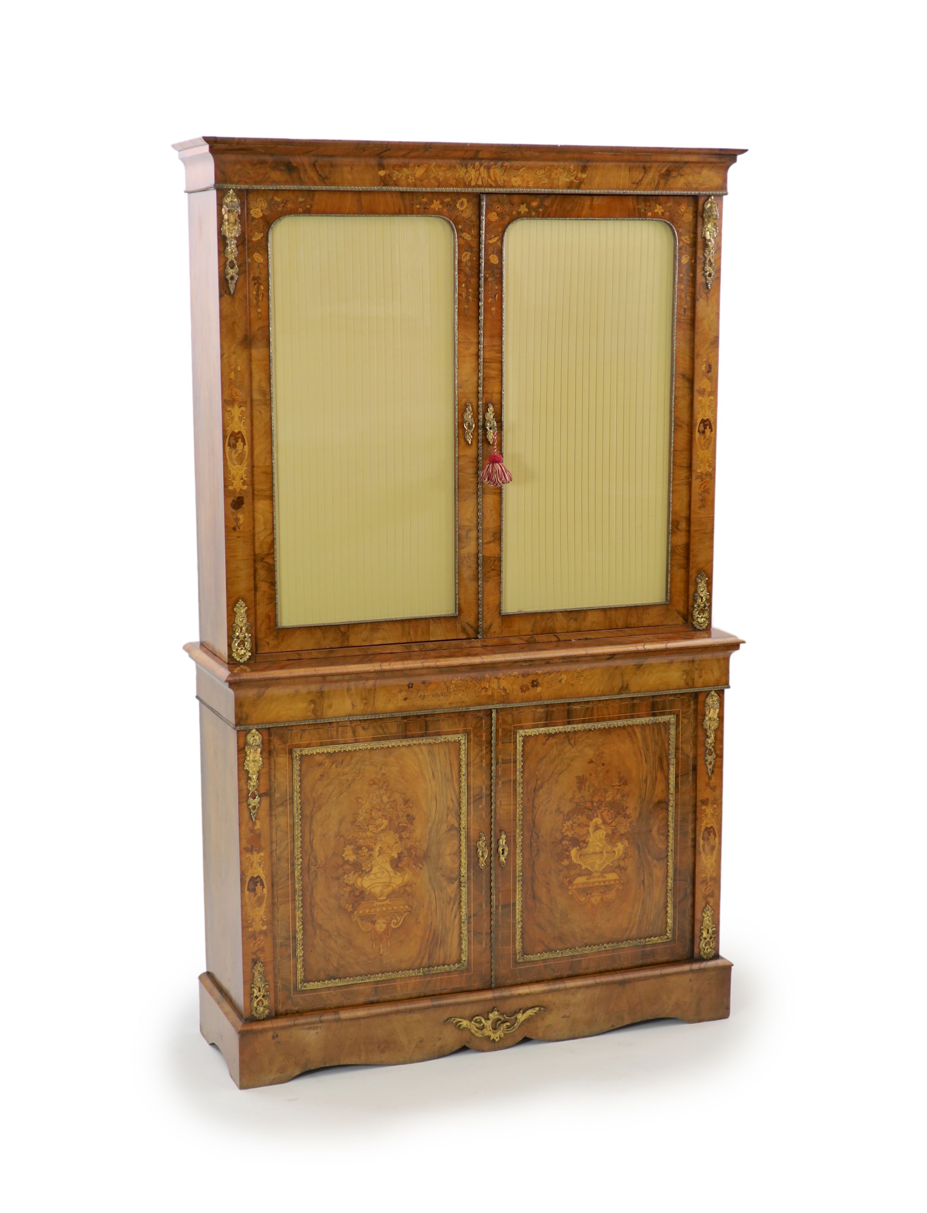 A Victorian ormolu mounted marquetry inlaid walnut bookcase, W.127cm D.40cm H.208cm